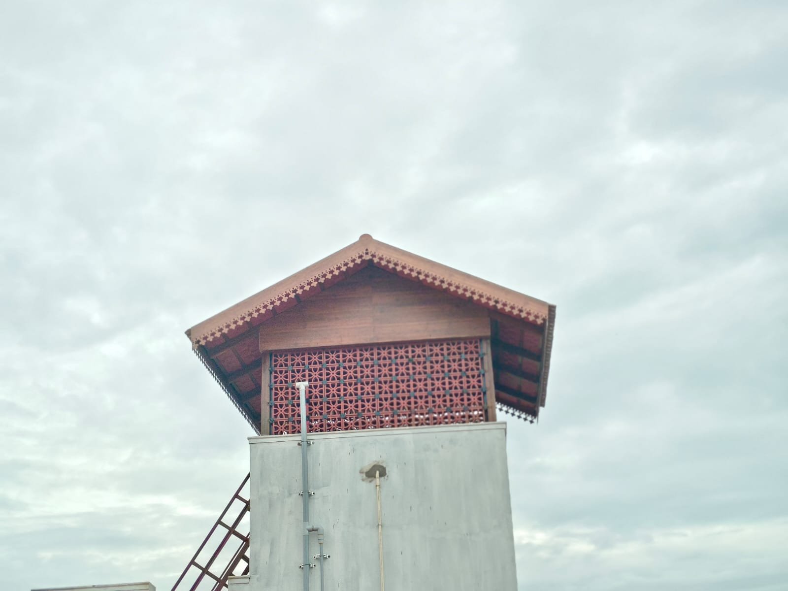 Rooftop water tank with decorative tiled canopy