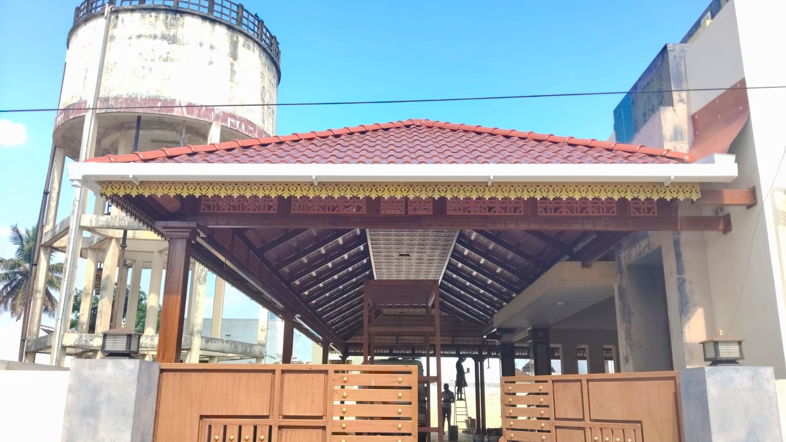 Entrance canopy with red tiles and decorative valance