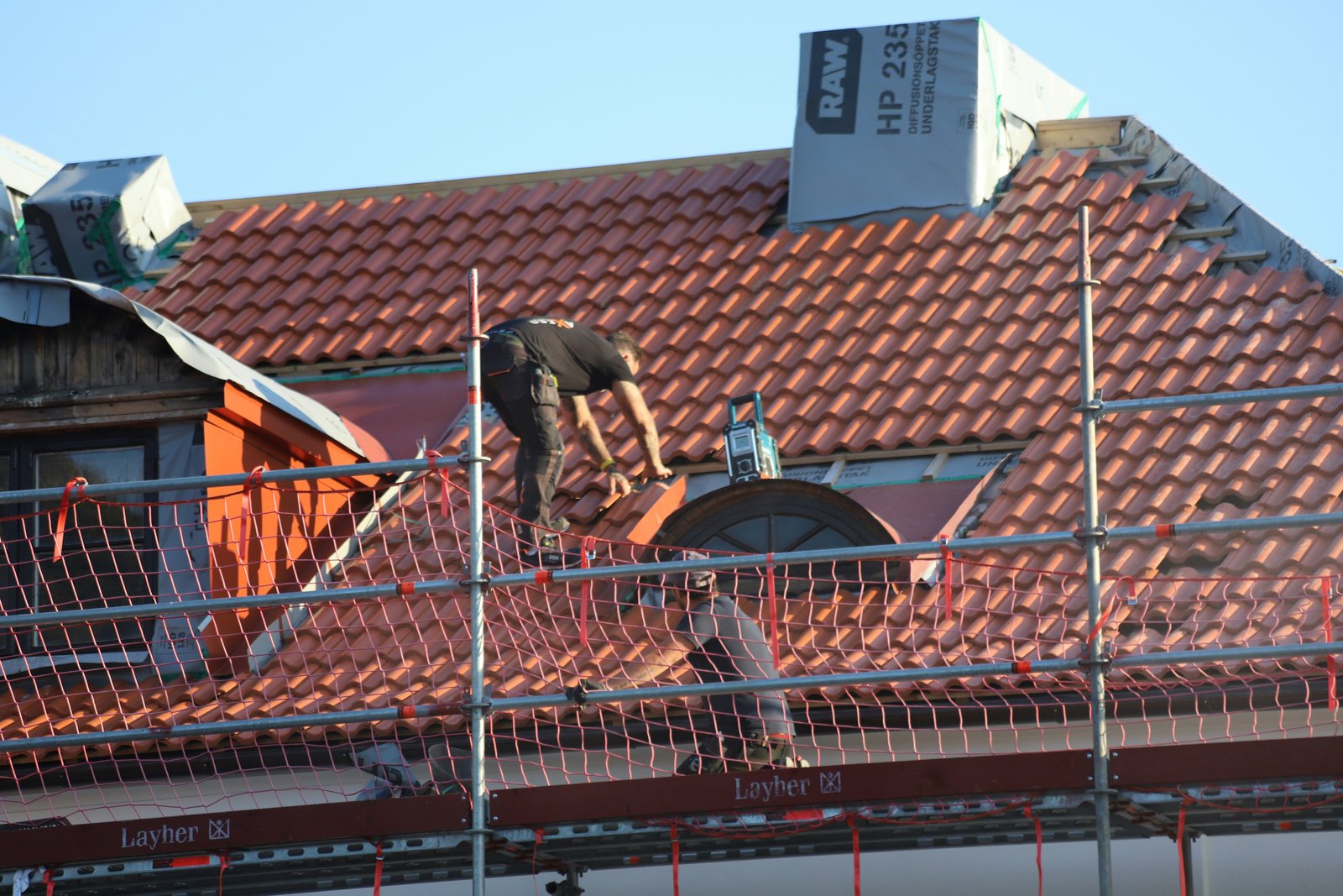 RV Roofing residential roof installation with stone coated tiles
